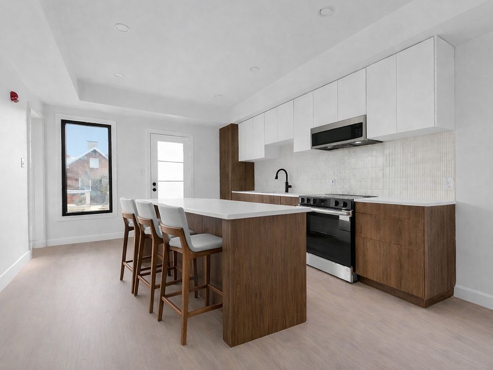 Kitchen with island seating at 77 Florence
