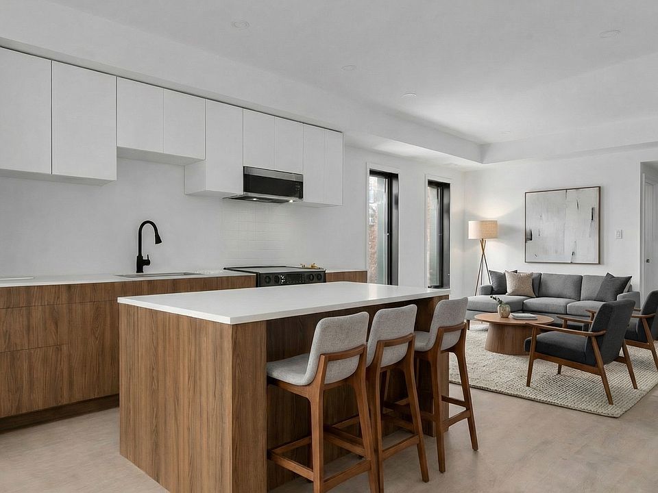 Island kitchen and living space at 77 Florence